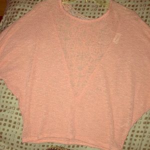 Light pink shirt with a flower embroidered back